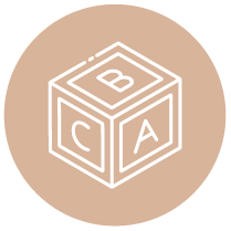 A brown circle with a white outline of a toy block showing the letters A, B, and C on its visible sides.